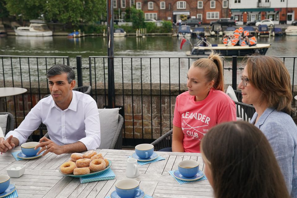 The Lib Dems even cheekily tried to photobomb Rishi Sunak while he was talking to members of a rowing club (Jonathan Brady/PA)