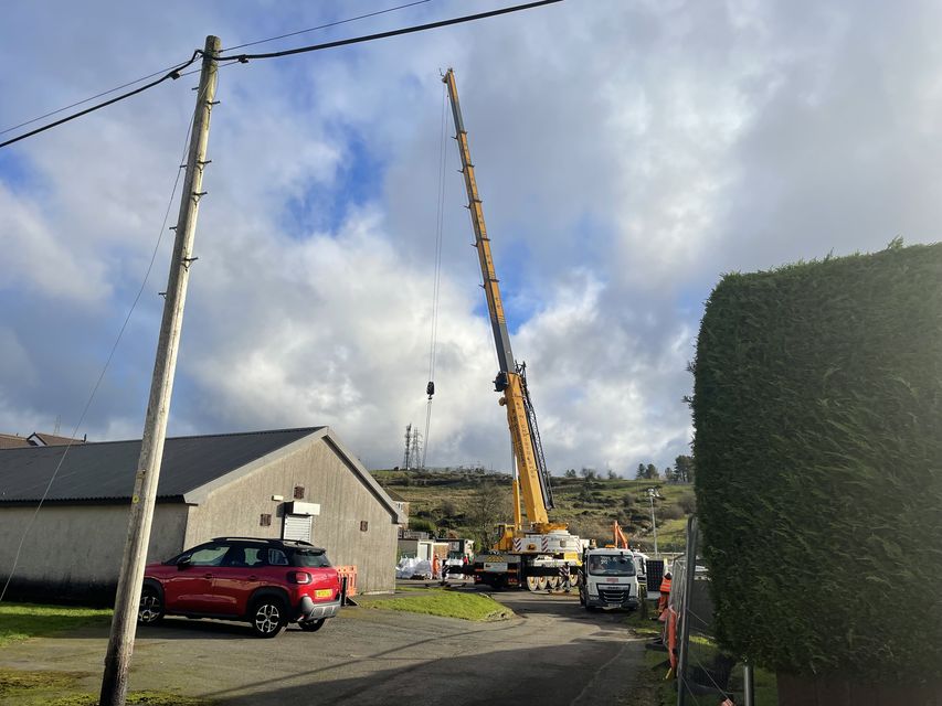 One of the cranes used to help stabilise the road in Nant Morlais, Pant (PA)