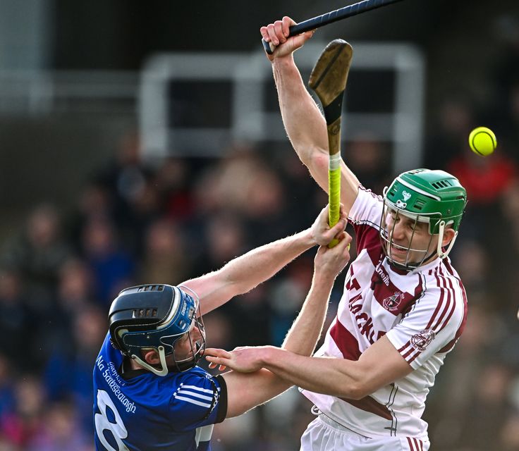 Sarsfields' Cian Darcy jostles with Slaughtneil counterpart Shane McGuigan during the sides' clash