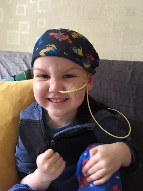 Three year old marks end of cancer treatment with family as bell