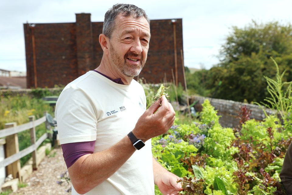 Chris Boardman picking lettuce in Lewes Football Club’s own garden (Lia Toby Media Assignments/PA)