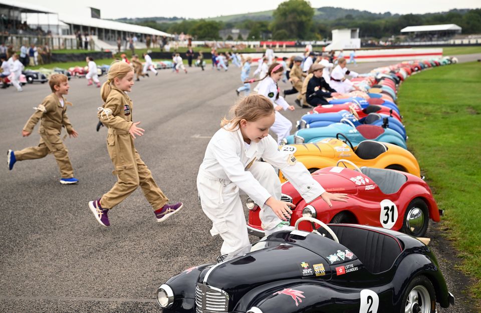 Young racers run to their vehicles as they prepare to compete in the Settrington Cup (John Nguyen/PA)