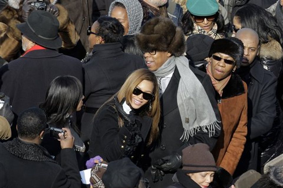 Jay-Z and Beyonce try to find their seats as they arrive for the inauguration ceremony at the U.S. Capitol in Washington, Tuesday, Jan. 20, 2009.  (AP Photo/Jae C. Hong)