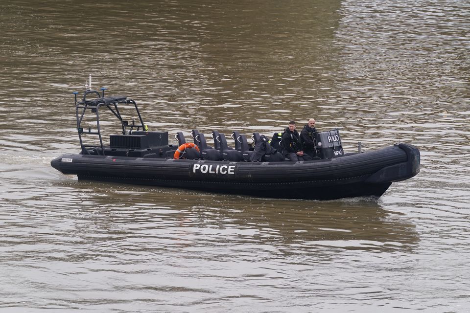 Members of the Metropolitan Police Marine Policing Unit searched for the body (Lucy North/PA) 