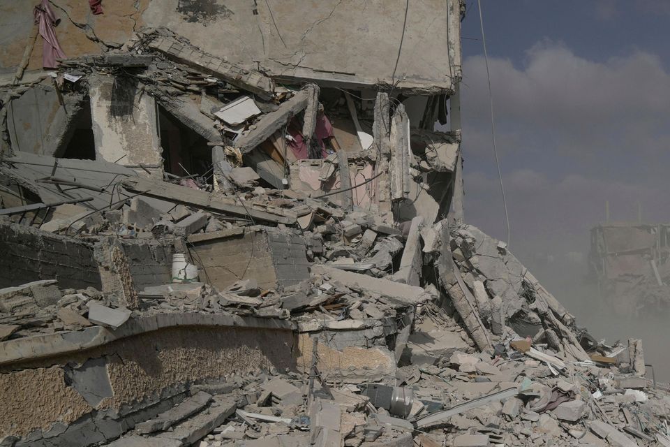 Israeli soldiers drive near destroyed buildings during a ground operation in the Gaza Strip (Leo Correa/AP)