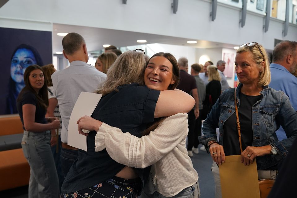 Katie Smallwood celebrates after getting her A-level results at Solihull School in the West Midlands (Jacob King/PA)