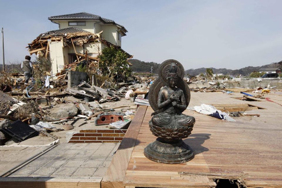 A statue is all that remains of a house in the seaside town of Toyoma, northern Japan, Monday, March 14, 2011, three days after a giant quake and tsunami struck the country's northeastern coast. (AP Photo/Mark Baker)