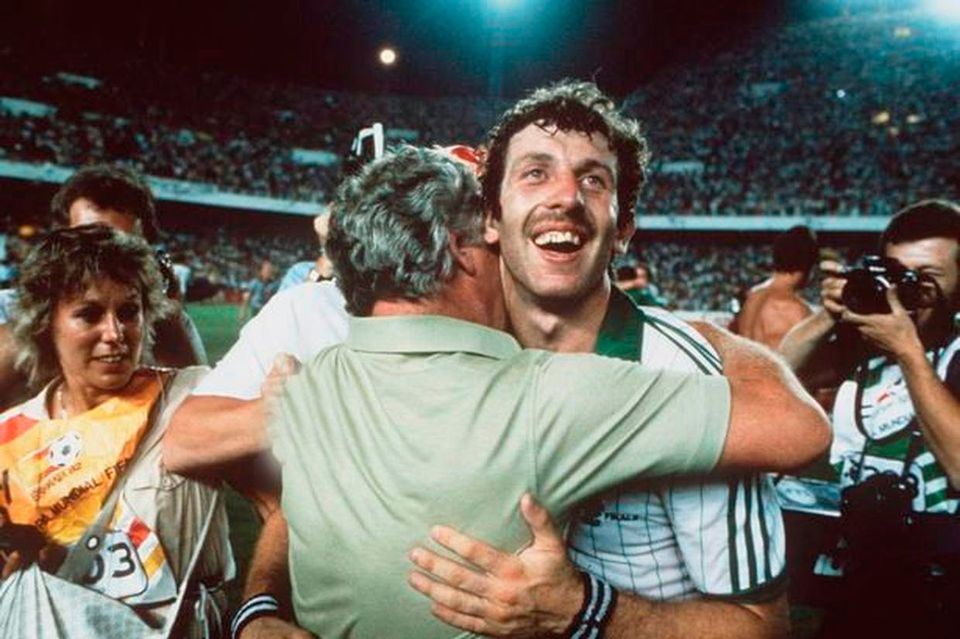 Manager Billy Bingham hugs goalscorer Gerry Armstrong after Northern Ireland's defeat of Spain