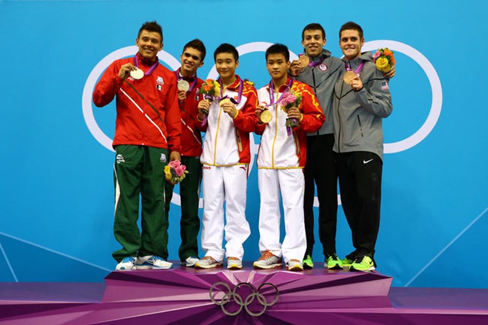 LONDON, ENGLAND - JULY 30:  (L-R) Silver medalists German Sanchez Sanchez and Ivan Garcia Navarro of Mexico, gold medalists Yuan Cao and Yanquan Zhang of China and bronze medalists Nicholas Mccrory and David Boudia of the United States celebrate celebrate on the podium with their medals during the medal cermony for the Men's Synchronised 10m Platform Diving on Day 3 of the London 2012 Olympic Games at the Aquatics Centre on July 30, 2012 in London, England.  (Photo by Al Bello/Getty Images)