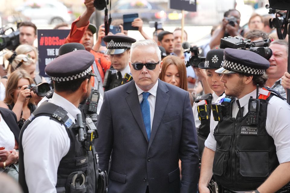 Huw Edwards was surrounded by police as he arrived at Westminster Magistrates’ Court on Wednesday morning (Jonathan Brady/PA)