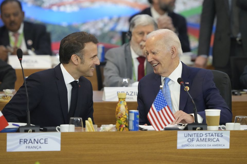 US President Joe Biden, right, and France’s President Emmanuel Macron talk during the G20 Summit (AP Photo/Eraldo Peres)