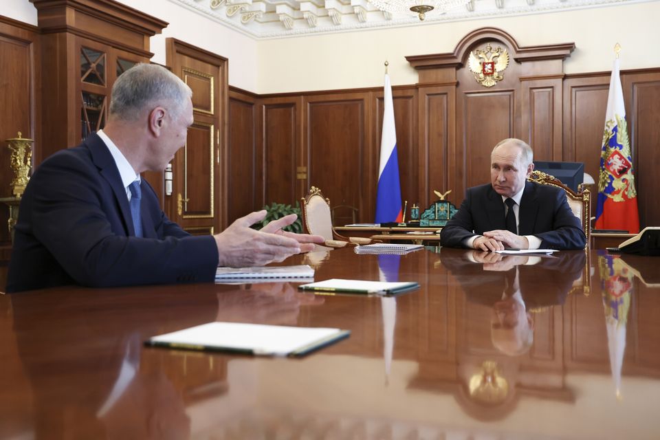 Russian President Vladimir Putin, right, listens to Vladimir Saldo, the Moscow-appointed governor of the Russian-controlled Kherson region of Ukraine, during their meeting at the Kremlin in June (Vyacheslav Prokofyev, Sputnik, Kremlin Pool Photo via AP)