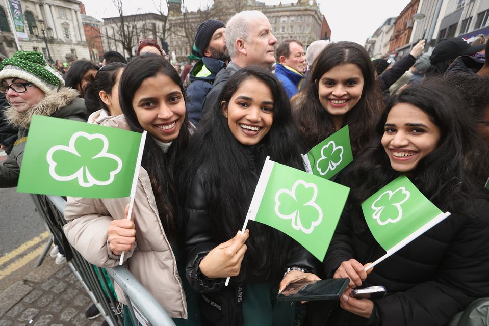 People attending the St Patrick’s Day Parade in Belfast (Liam McBurney/PA)