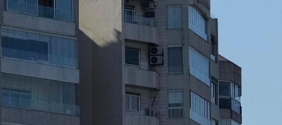 This combination of photographs shows a bomb dropped from an Israeli jet as it hits a building in Tayouneh, Beirut, Lebanon (Hassan Ammar/AP)