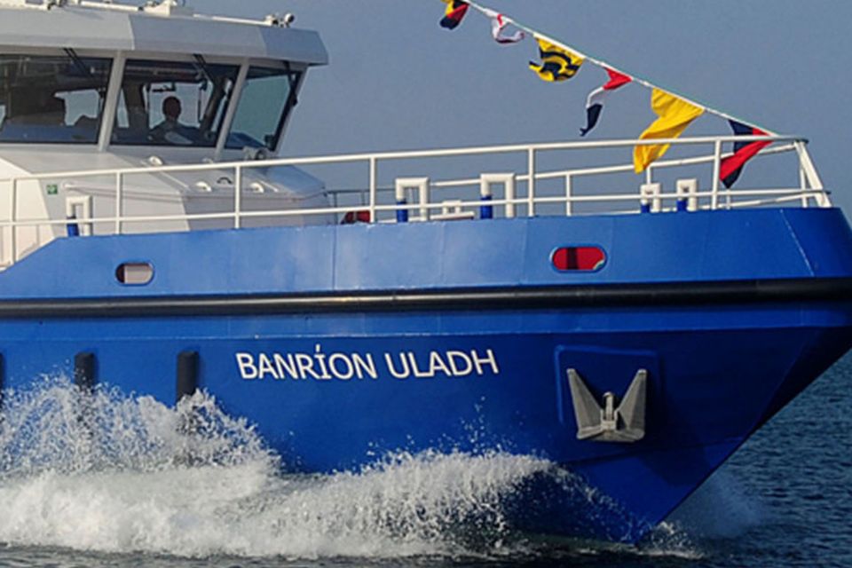The fisheries vessel with its name in Irish on the hull