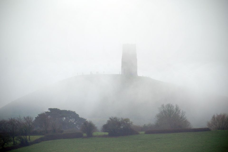 Foggy conditions at St Michael’s Tower on top of Glastonbury Tor, Somerset, ahead of new year celebrations (Ben Birchall/PA)