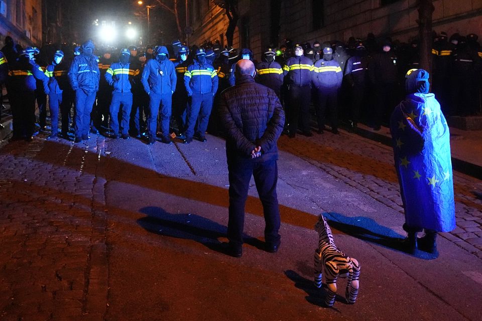 Police block demonstrators during a rally outside the parliament (Pavel Bednyakov/AP)