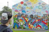 thumbnail: Free Derry Corner, which was dramatically covered by a mural on Saturday to mark the city’s annual Gasyard Feile