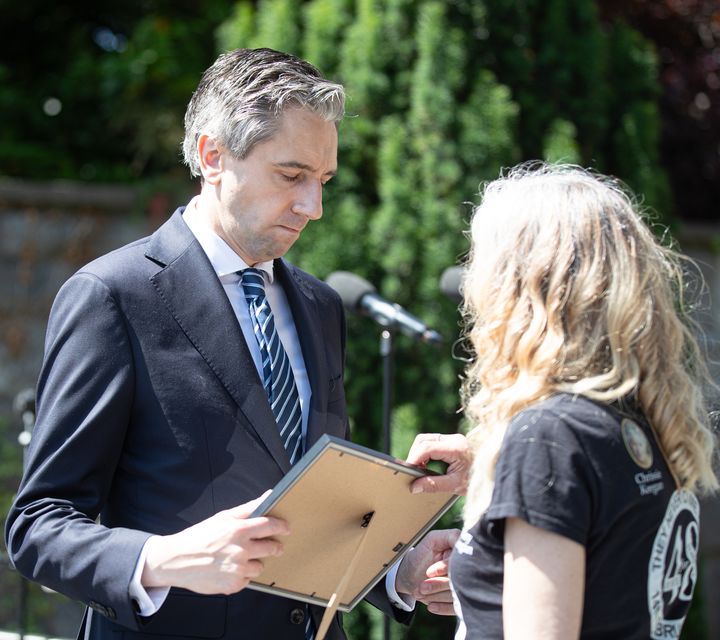 Taoiseach Simon Harris with Stardust survivor and campaigner Antoinette Keegan (Damien Storan/PA)