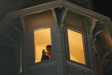 thumbnail: An unidentified guest of the Taj Hotel watches other guests being rescued from a window of the hotel in Mumbai, India, Thursday, Nov. 27, 2008. Teams of heavily armed gunmen have stormed luxury hotels and other sites in coordinated attacks across India's financial capital, killing at least 82 people and taking Westerners hostage. (AP Photo/Gautam Singh)
