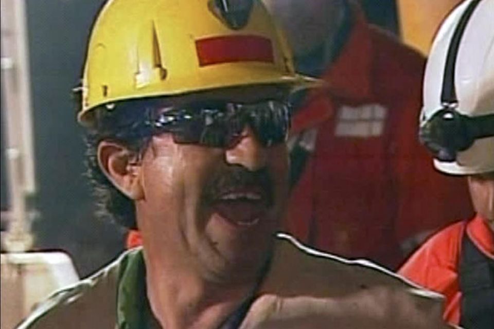 In this screen grab taken from video, Juan Andres Illanes, the third miner to be rescued, celebrates after his rescue Wednesday, Oct. 13, 2010 at San Jose Mine near Copiapo, Chile. (AP Photo)