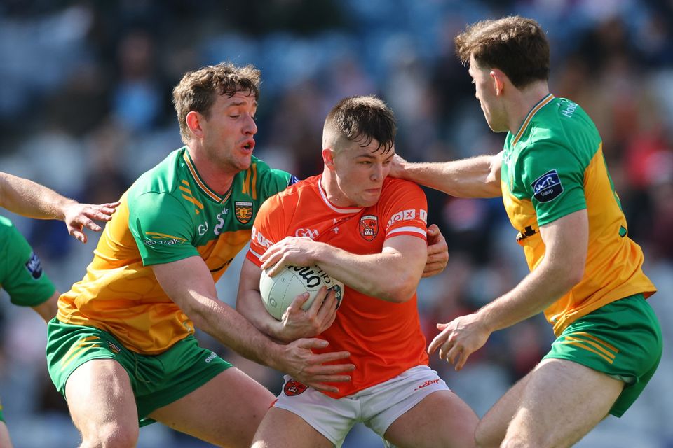 Armagh’s Peter McGrane takes on Donegal’s Hugh McFadden and Michael Langan in the Division Two Final ahead of their reunion in the Ulster decider