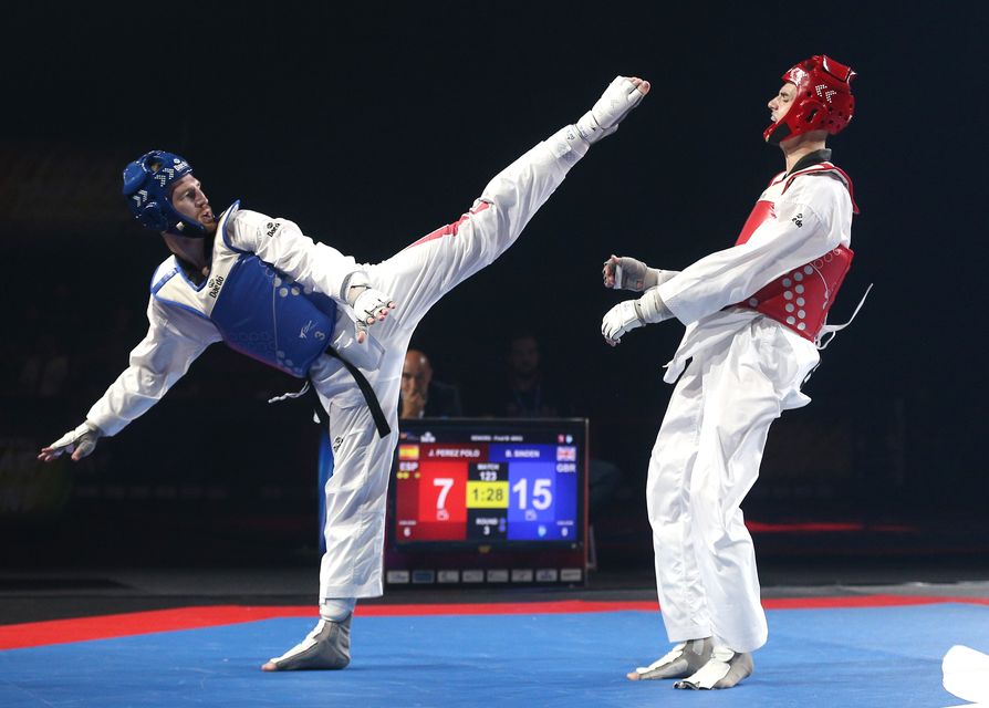 Bradly Sinden (Blue) and Spain’s Javier Perez Polo at the European Taekwondo Championships in 2022 (Nigel French/PA)