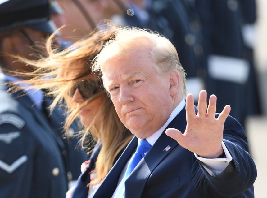 US President Donald Trump waves to the media (Joe Giddens/PA)