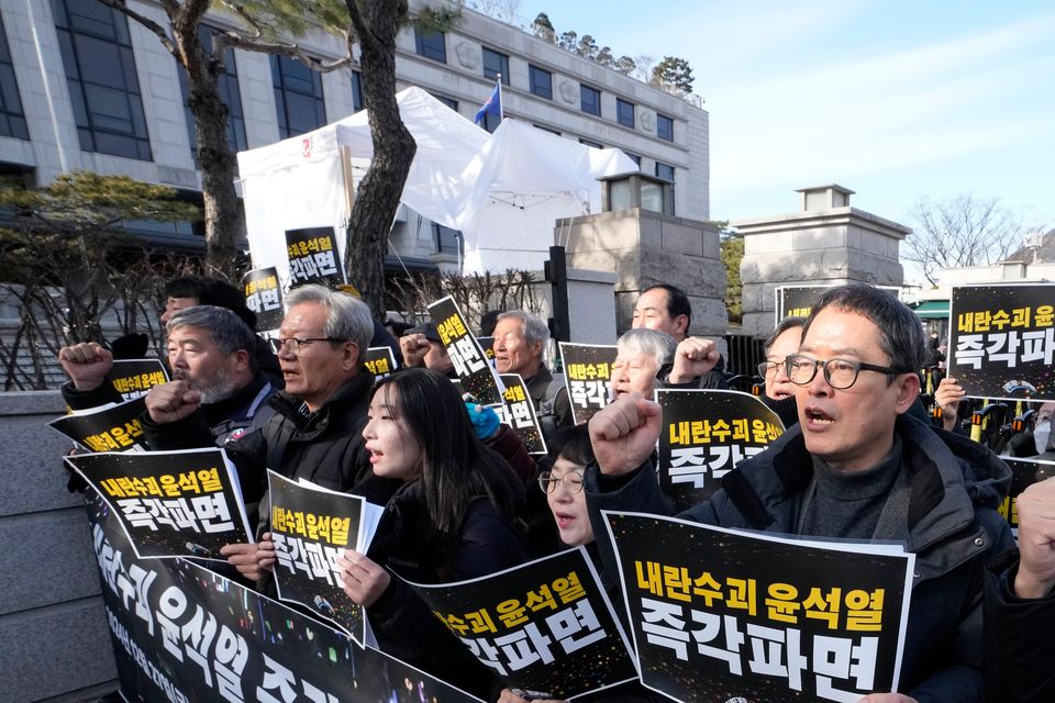 Protesters stage a rally demanding the arrest of impeached South Korean President Yoon Suk Yeol outside of the Constitutional Court in Seoul (AP/Ahn Young-joon)