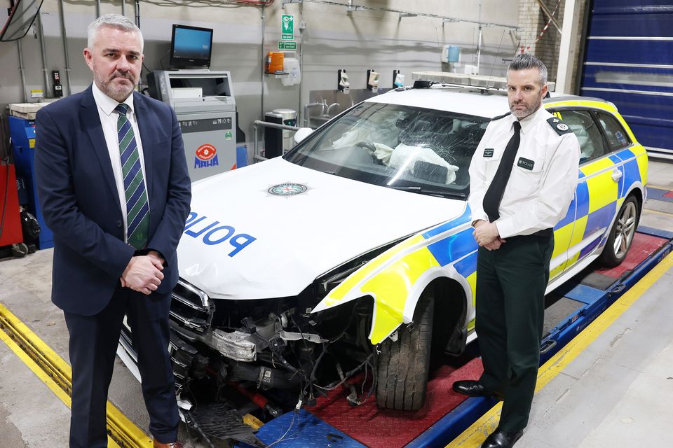 Deputy Chief Constable Bobby Singleton and Chair of the Police Federation for Northern Ireland Liam Kelly pictured with a damaged car. Picture by Jonathan Porter/PressEye