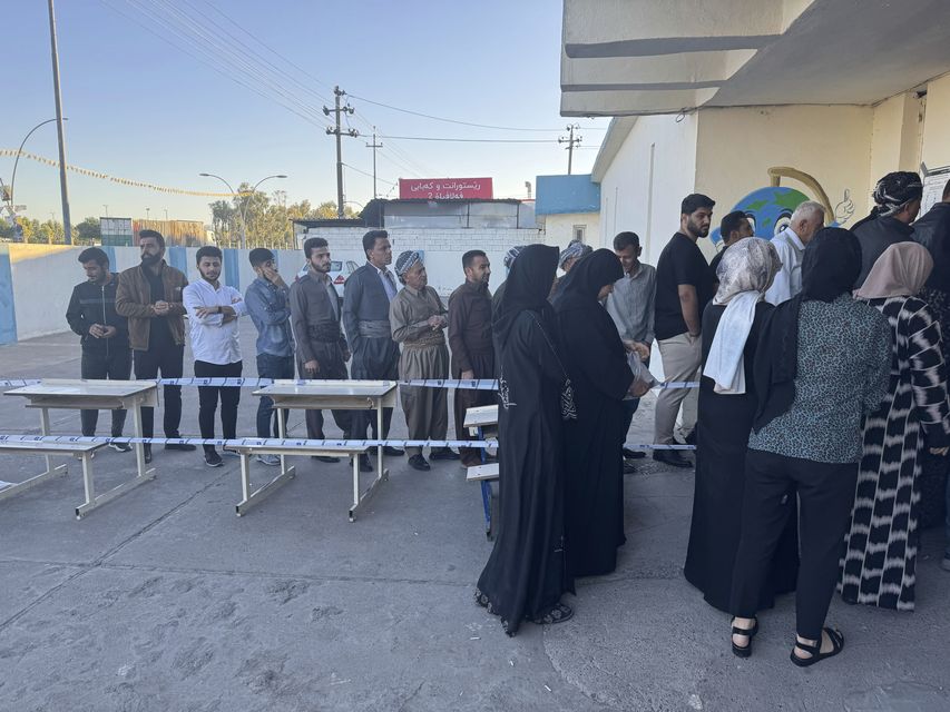 People queue up to vote in Irbil during parliamentary elections in Iraq’s semi-autonomous northern Kurdish region (Salar Salim/AP)