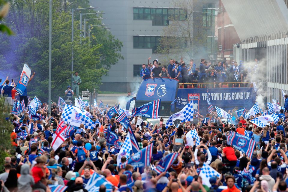 Ipswich Town players during an open-top bus parade in Ipswich to celebrate promotion to the Premier League. Pic: Chris Radburn