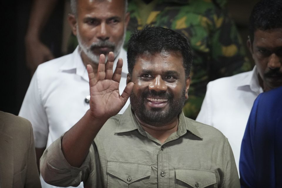 Mr Dissanayake waves as he leaves from the election commission office after winning Sri Lankan presidential election (Rajesh Kumar Singh/AP)