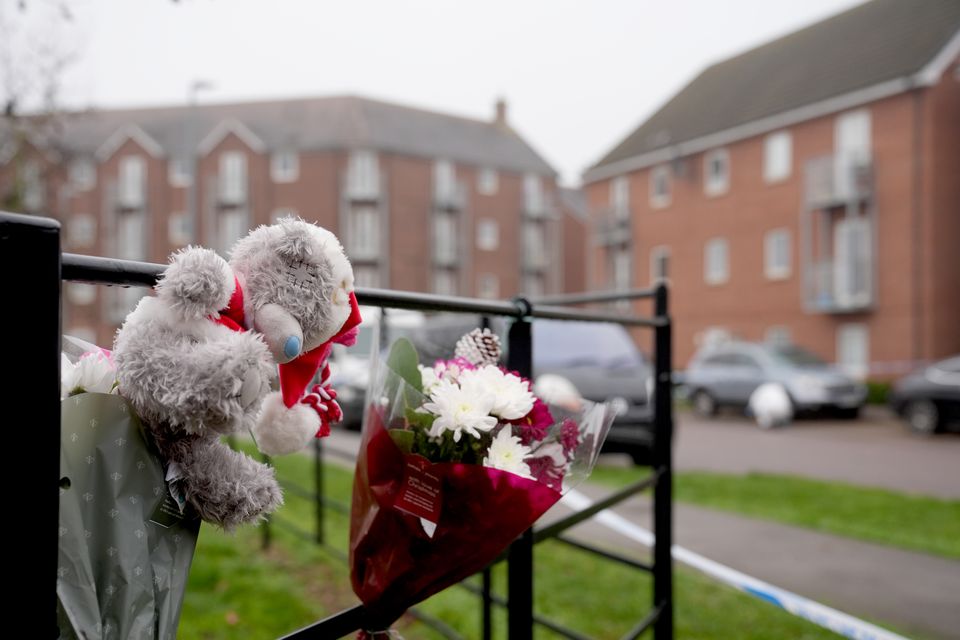 Floral tributes have been left at the scene (PA)