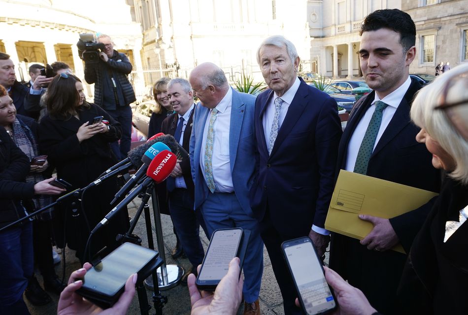 Members of the Regional Independent Group Michael Lowry and Gillian Toole, Kevin ‘Boxer’ Moran, Noel Grealish, and Barry Heneghan speaking after a deal was reached to form Ireland’s next government with an agreement finalised between Fianna Fail Fine Gael and the Regional Independent Group (Brian Lawless/PA)