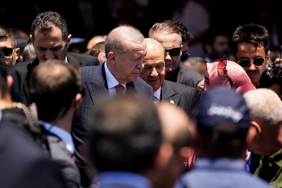 Mr Erdogan and Cypriot leader Ersin Tatar met the public in Nicosia (AP)