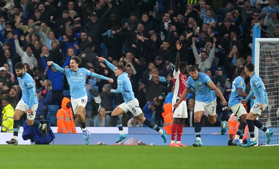 John Stones (centre) salvaged a draw for Man City (Martin Rickett/PA)