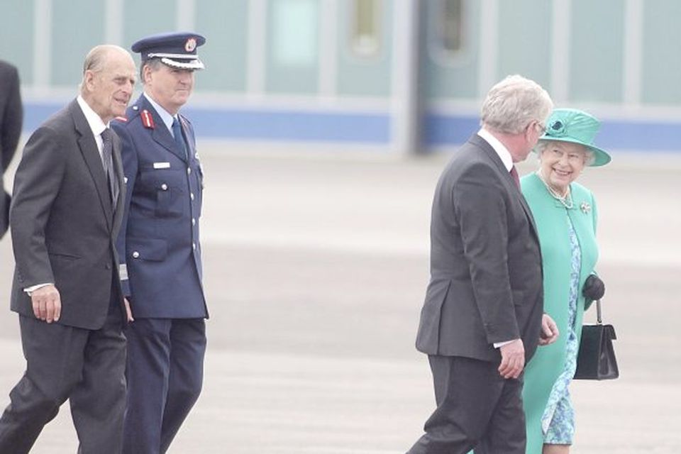 Britain's Queen Elizabeth II and the Duke of Edinburgh are greeted by Tanaiste Eamon Gilmore (front) upon arrival at Casement Aerodrome, Baldonnel, ahead of a four day state visit.