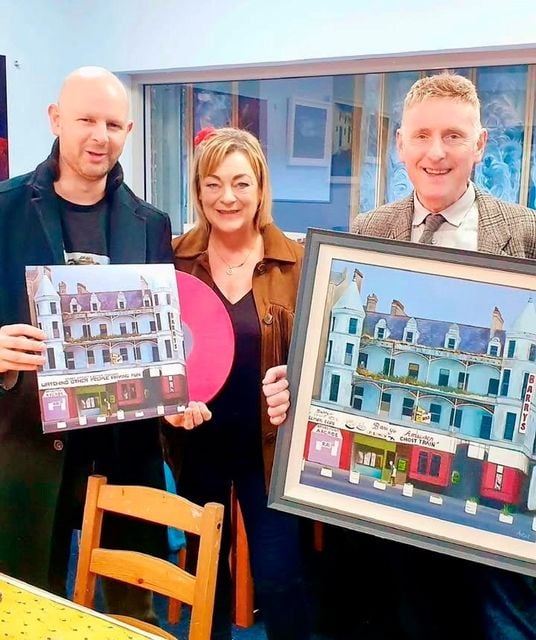 Stuart Leathem with artist Angie McKee and his new red vinyl record featuring her art, and Nicky Hillis, who owns the original painting by Angie.