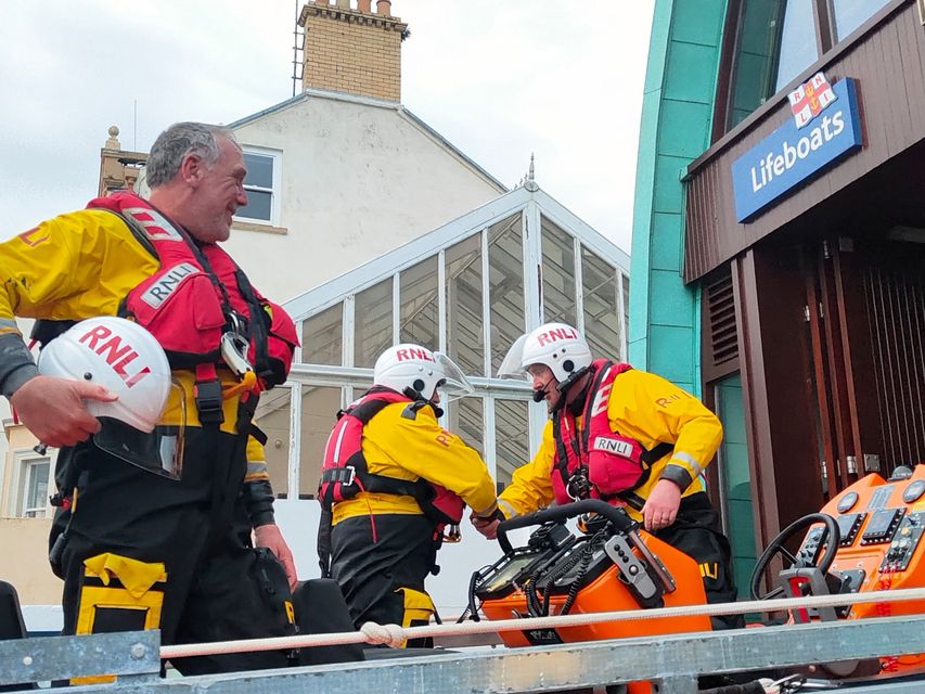 Portaferry RNLI crew members congratulate Paddy Lowry after his first call out as helm of the inshore lifeboat, Blue Peter V. From left: Steven Lloyd, Paddy Lowry and Paul Mageean. Pic: RNLI