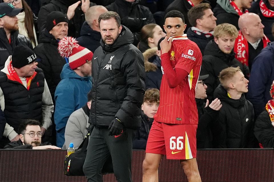 Liverpool’s Trent Alexander-Arnold, right, will miss the Carabao Cup final on Sunday after being injured in their Champions League defeat to Paris St Germain (Martin Rickett/PA)