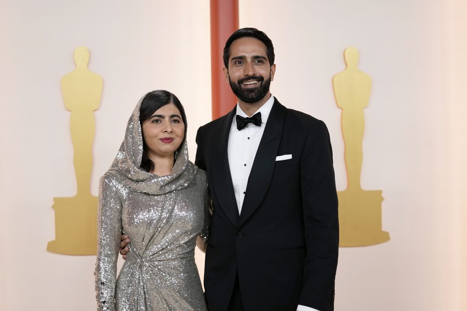 Malala Yousafzai and Asser Malik arrive at the Oscars (Ashley Landis/AP)