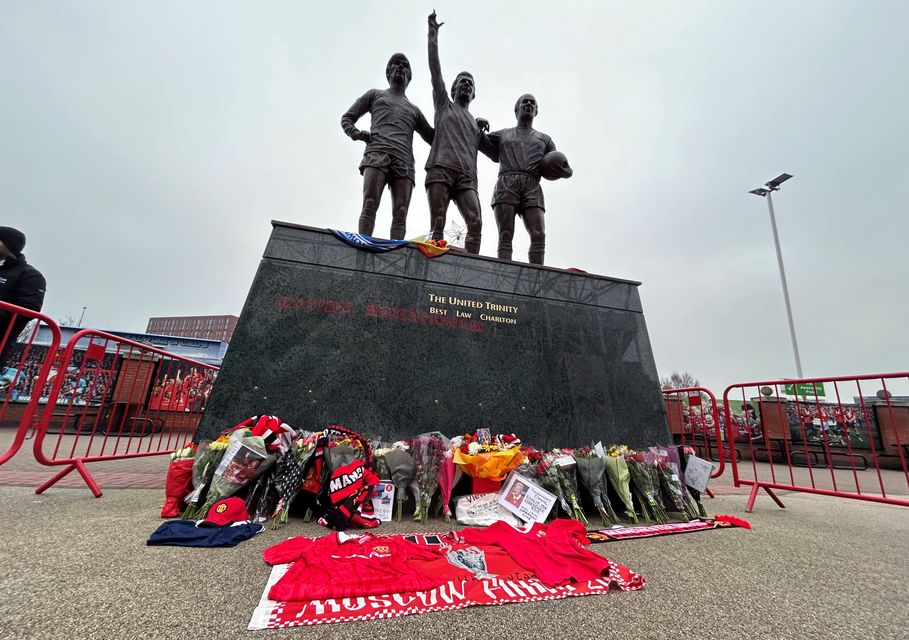 Tributes were laid outside Old Trafford in memory of Denis Law (Martin Rickett/PA)