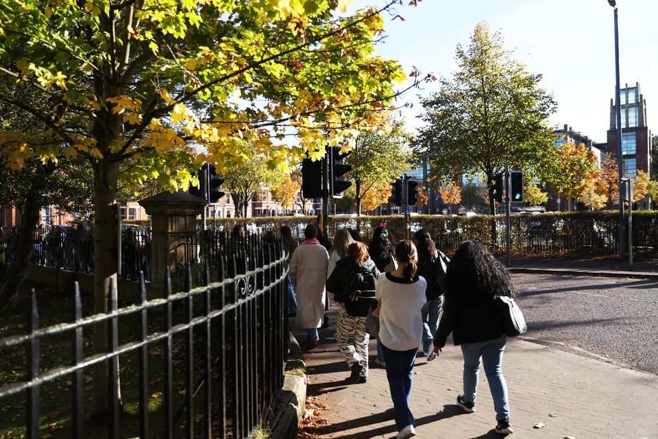 Students from Queens University take part in their regular organised walk through Belfast