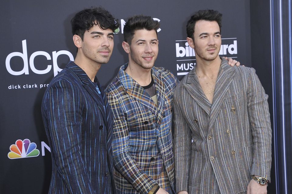 The Jonas Brothers, from left, Nick, Joe and Kevin perform during