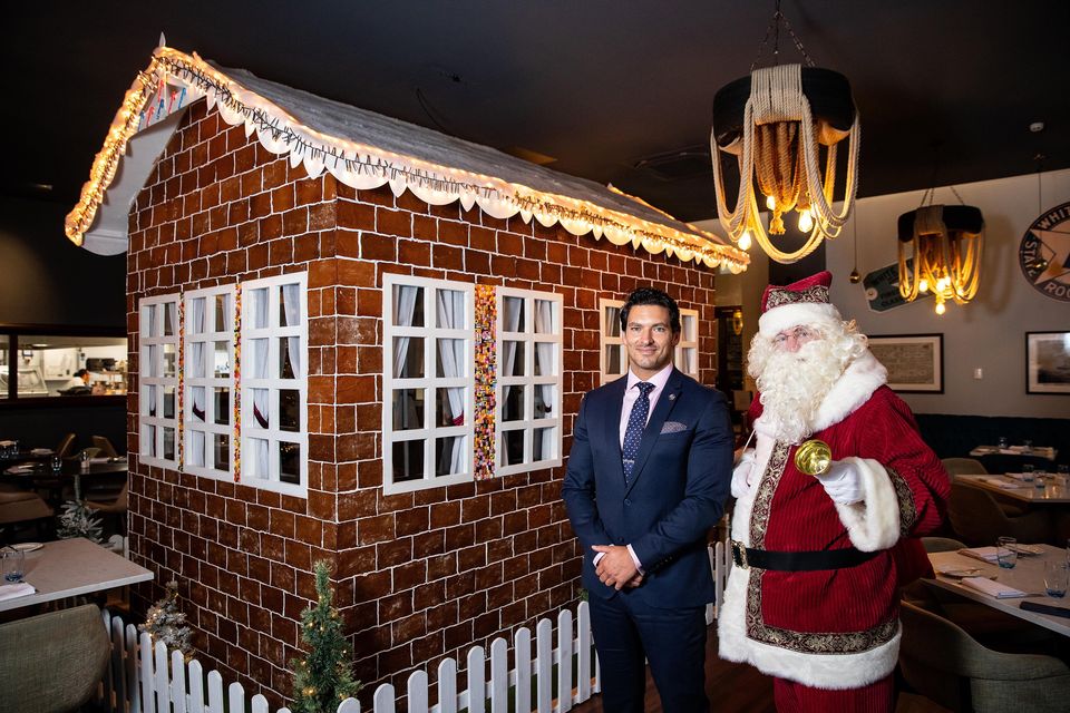 Hotel deputy manager Matthew Poole with Santa