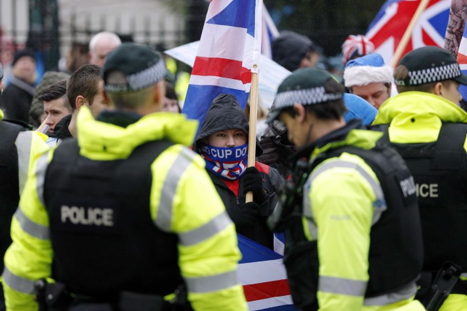 Loyalist protestors and PSNI officers pictured at Belfast City Hall on 22 December 2012