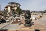 thumbnail: A statue is all that remains of a house in the seaside town of Toyoma, northern Japan, Monday, March 14, 2011, three days after a giant quake and tsunami struck the country's northeastern coast. (AP Photo/Mark Baker)