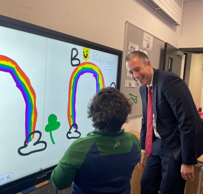 Paul Givan during a visit to Bunscoil Phobal Feirste in west Belfast