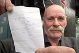 thumbnail: Noel Cairns holds a shopping list given to him by former snooker champion Alex Higgins, near Ulidia House in south Belfast where Higgin's body was discovered.